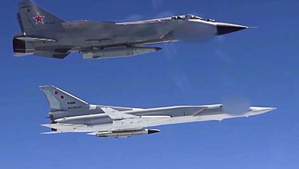 Russian fighters armed with Kinzhal hypersonic missiles hold drills with strategic bombers